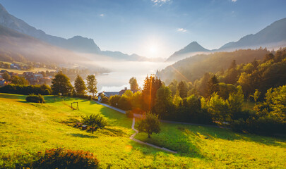 Sticker - Impressive views of the morning garden in sunlight. Archkogl, Grundlsee, Austria.