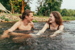 © Hip.hub - Happy young couple in the water. Hug each other. Summer love. Romantic mood. Tenderness. Relationships. Holiday concept.