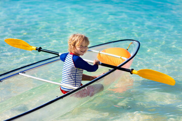 Wall Mural - Kids kayaking in ocean. Family in kayak in tropical sea