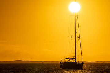 Wall Mural - Sailboat at sunset in Los Roques National Park, Venezuela