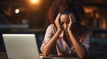 Frustrated African businesswoman with laptop and headache in trouble, burnout or depression in doubt, fail or mistake at office Generative AI