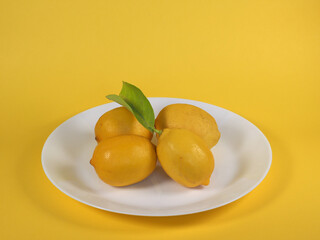 Wall Mural - lemons in a dish