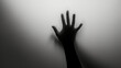 © Vladimir - Hand silhouette on grey background. Blurred human hand shape out of focus