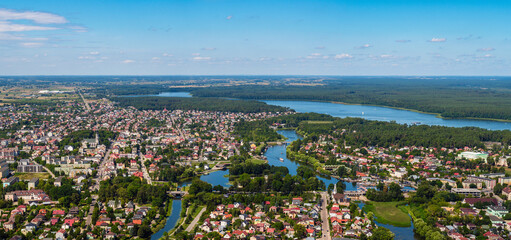 Wall Mural - Augustow city by Netta river and Necko lake aerial landscape under blue sky