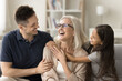 © fizkes - Happy adult son and little granddaughter girl hugging happy grandma with love, affection, smiling, laughing, celebrating family event, holiday, mothers day, spending funny leisure time at cozy home