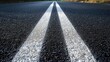 © Mas - Close up shot black asphalt road and white dividing lines