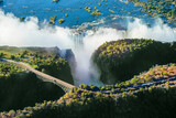 Air view of the Victoria falls waterfall on Zambezi river. Livingston Bridge above the river.