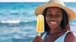 Young Smiling African American Woman Wearing Straw Hat Holding a Popsicle Smiling in Front of the Sea Ocean, Summer Concept, Traveling Concept, Frozen Treat, with Copy Space