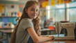 © buraratn - Side view portrait of smiling teenage girl with sewing machine on desk at high school