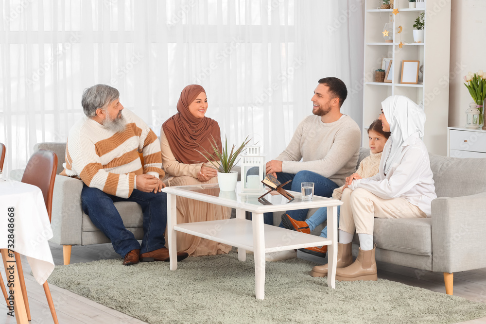 Happy Muslim family sitting at home. Ramadan celebration