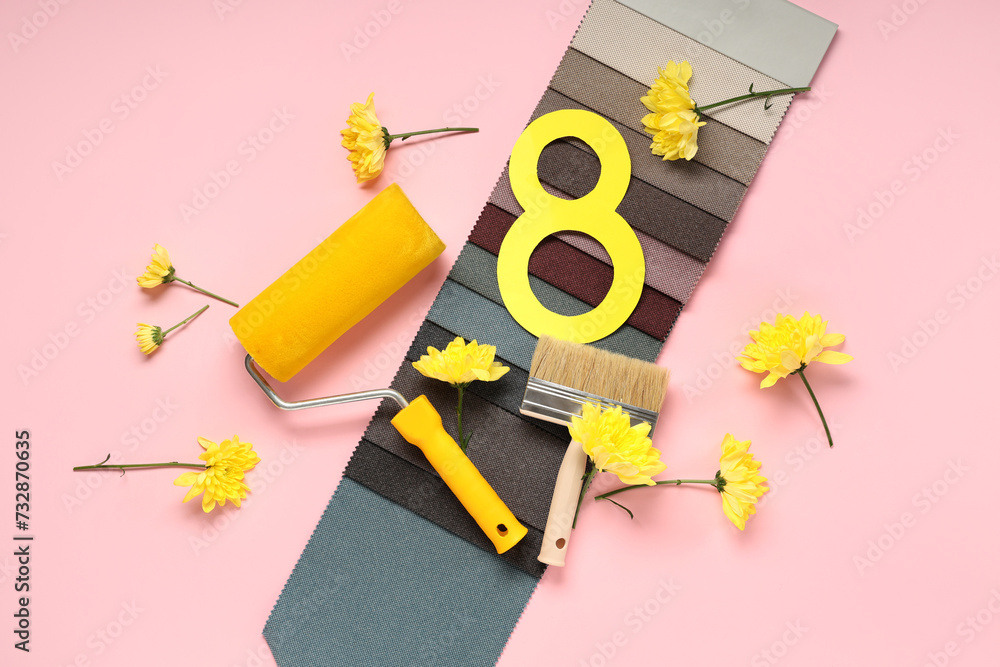 Composition with painter's tools, fabric samples and flowers on pink background. International Women's Day