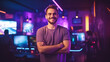 © Shanorsila - Smiling male streamer in gaming room standing with crossed arms, looking at camera.