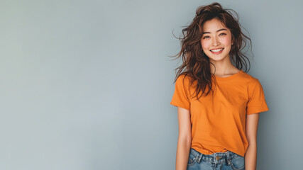 Wall Mural - Japanese woman wear orange casual t-shirt smile isolated