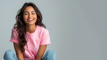 Wall Mural - Indian woman wear pink casual t-shirt smile isolated