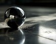a shiny metal ball sitting on the ground