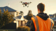 Professional man doing a house flight over mission using a drone to measure and inspect roof