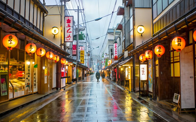 Naklejka na meble Japanese street view on night time, rainy weather illustration. Various market or shops beside footpath.