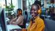 © Alina Tymofieieva - Portrait of happy African Americans working in a call center with a headset in the office. A call center agent with a headset makes a video call.