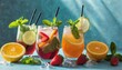 colorful cocktails with fruit and mint on a blue background summer aesthetic trendy refreshing drink