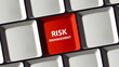 Keyboard with a red key that says risk management money stock insurance savings