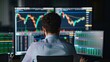 © พงศ์พล วันดี - Trader with multiple screens showing stock market data