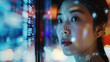 © Akmalism - Portrait of Asian Female Startup Digital Entrepreneur Working on Computer, Line of Code Projected on Her Face and Reflecting. Software Developer Working on Innovative e-Commerce App using AI.