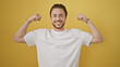 © Krakenimages.com - Young hispanic man smiling confident doing strong gesture with arms over isolated yellow background