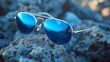 Sophisticated aviator sunglasses with titanium frames and blue polarized lenses.