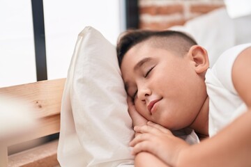 Sticker - Adorable hispanic boy lying on bed sleeping at bedroom