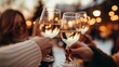 © Stock Artistry - People cheers, making toasts with wine and champagne glasses at a party celebration with friends enjoy a Christmas winter evening, Generative AI