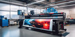 © Wararat - A large wide digital printer machine during production in background of modern print shop.