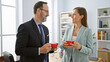 © Krakenimages.com - Two confident business workers enjoying morning espresso together, mingling over work matters at the office while smiling