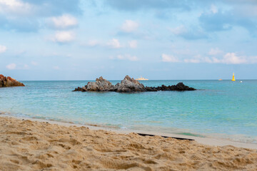 Beautiful views of the beach, sea, rocks during the day.