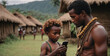 African Native Man With His Son Studying Smartphone In Their African Straw Village. Concept of digitalization of the world and wild tribes. The development of civilization.