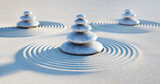 Fototapeta Dmuchawce - Japanese zen garden - three stacks of pebbles in the evening sun - 3D illustration
