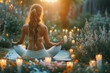 Back side view. A young woman doing a yoga with candles on deck in spring evening garden.