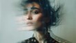 Woman portrait on grey background. Blurred face hand shape out of focus. Mysterious and sensitive female portrait in fashion art style