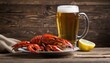 A glass of beer with a plate of lobster on a wooden table