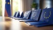 array of voting envelopes marked 'EU Election' on a sleek table and EU Flags on Blue Folders in a Conference Room