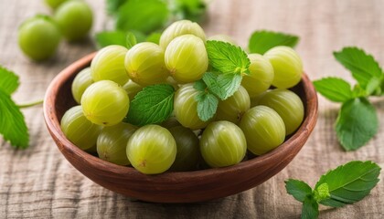 Poster - A bowl of green grapes with leaves