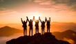 back view of silhouettes on the mountain with raising hands for leadership and success in the business concept.