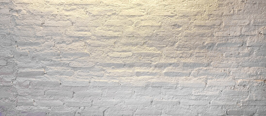 Wall Mural - close up grunge white brick wall with yellow light from above in minimal style. white empty brick wall illuminated by light from the ceiling.