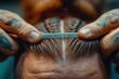 © yuliachupina - Close-up of a barber's skilled hands crafting a perfect hairstyle