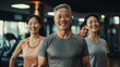 © pinkrabbit - Smiling group older of friends in sportswear laughing together while standing arm in arm in a gym after a workout, senior, healthy, friendship, adult, exercising, together, lifestyles