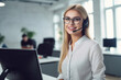 portrait of a woman call center operator with headphones