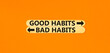 Good or bad habits symbol. Concept word Good habits Bad habits on beautiful wooden stick. Beautiful orange table orange background. Business good or bad habits concept. Copy space.