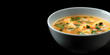 Tom Yum Goong Soup with Fresh Shrimp. Thai Tom Yum soup garnished with cilantro in a bowl, copy space.