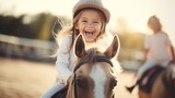 Smiling girl riding horse at equitation lesson, wearing helmet, looking at camera