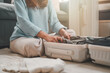baggage, vacation, bag, clothes, journey, suitcase, travel, holiday, pack, packing. suitcase and woman packing in bedroom preparing for vacation, holiday or trip. clothing getting ready for traveling.