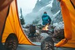 A lone adventurer sits in a cozy tent, surrounded by the rugged beauty of the mountains, their trusty pot and fire keeping them warm as they prepare for their next hiking adventure